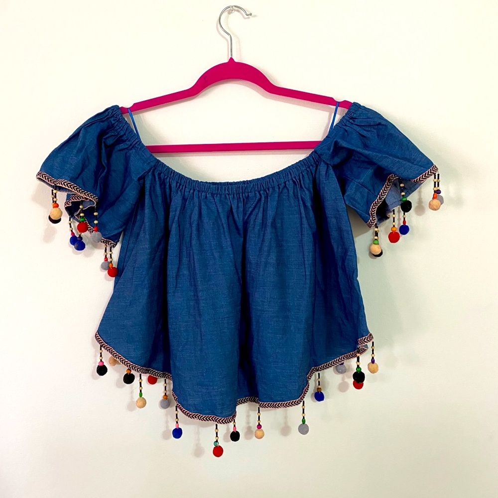 Off the shoulder blouse with dangling puff balls